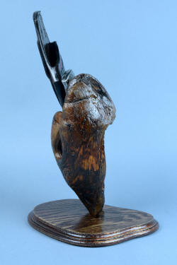 "Golden Eagle" custom knife, sheath, and stand, with Ponderosa pine burl mounted on antiqued red oake base, back side view showing bold curves and interesting shape