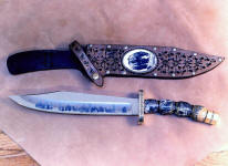 "Grizzly" in etched 440C high chromium stainless steel blade, brass, nickel silver guard and pommel, Quartz with Pyrite gemstone, Ebony handle, hand-tooled leather sheath with scrimshawed ivory