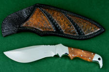 "Hooded Warror" obverse side view in 440C high chromium stainless steel blade, 304 stainless steel bolsters, Amboyna burl hardwood handle, hand-tooled,  hand-dyed leather sheath