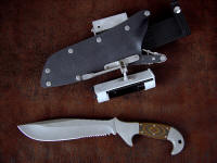 "Imamu" obverse side view in ATS-34 high molybdenum stainless steel blade, 304 stainless steel bolsters, tiger stripe G10 fiberglass/epoxy composite handle, locking kydex, aluminum, stainless steel sheath with ultimate belt loop extender, diamond sharpener, firesteel/magnesium fire starter, HULA flashlight holder with XL series Maglite