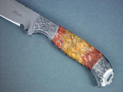 "Izar" obverse side handle detail. Sunset Jasper has rusty reds, oranges, and yellows with black and agate seams