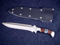 "Kadi" Obverse side view: 440c high chromium stainless steel double hollow ground blade, 304 stainless steel bolsters, Mahogany Obsidian and Snowflake Obsidian gemstone handle, aluminum, kydex, nickel plated steel sheath