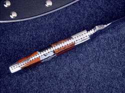 "Kadi" spine view, edgework, filework detail. Note fully tapered tang, dovetailed bolsters, matched gemstone mosaic