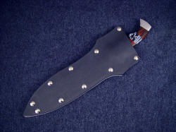 "Kadi" sheathed view. Sheath is large and deep, with aluminum welts and nickel plated steel screws