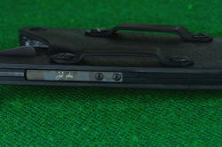 "Kairos" professional counterterrorism tactical knife, titanium spring detail with maker's mark on lock area of welt frame