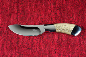 "Kochab" knife maker's mark detail in T3 deep cryogenically processed 440C high chromium martensitic stainless steel blade, 304 stainless steel bolsters, Petrified Sycamore Wood gemstone handle, sheath of lizard skin inlaid in hand-carved leather shoulder, nylon 