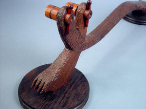 "Kochel" custom knife display stand, rear view. Hand-carved walnut blends well with other dark hardwoods: cocobolo, wenge, Honduras rosewood