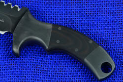 "Krag" tactical, counterterrorism professional knife, obverse side handle close up. Dark red and black G10 is toothy for secure grip, all surfaces have "Ghost Slate" subdued finish