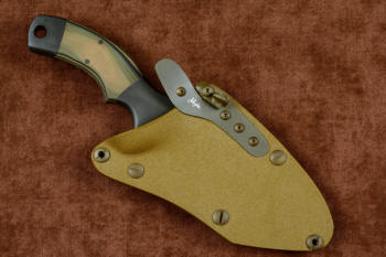 "Krag" tactical, counterterrorism, crossover knife, sheathed view in ATS-34 high molybdenum martensitic stainless steel blade, 304 stainless steel bolsters, coyote, black, olive G10 fiberglass/epoxy composite handle, hybrid tension tab-locking sheath in kydex, anodized aluminum, gold oxide stainless steel and anodized titanium