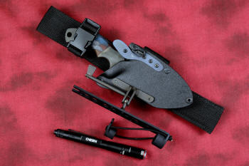 "Krag" tactical, counterterrorism, crossover knife, sheathed, UBLX, HULA view in ATS-34 high molybdenum martensitic stainless steel blade, 304 stainless steel bolsters, multicolored tortoiseshell  G10 fiberglass/epoxy composite handle, hybrid tension tab-locking sheath in kydex, anodized aluminum, black oxide stainless steel and anodized titanium