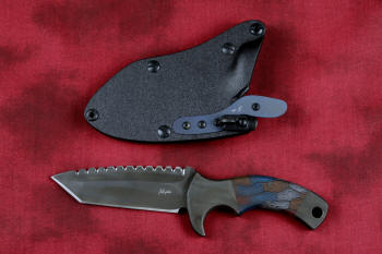 "Krag" tactical, counterterrorism, crossover knife,obverse side view in ATS-34 high molybdenum martensitic stainless steel blade, 304 stainless steel bolsters, multicolored tortoiseshell  G10 fiberglass/epoxy composite handle, hybrid tension tab-locking sheath in kydex, anodized aluminum, black oxide stainless steel and anodized titanium