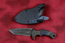 "Krag" tactical, counterterrorism, crossover knife, obverse side view in ATS-34 high molybdenum martensitic stainless steel blade, 304 stainless steel bolsters, multicolored tortoiseshell  G10 fiberglass/epoxy composite handle, hybrid tension tab-locking sheath in kydex, anodized aluminum, black oxide stainless steel and anodized titanium