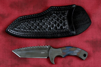 "Krag" tactical, counterterrorism, crossover knife, obverse side view in ATS-34 high molybdenum martensitic stainless steel blade, 304 stainless steel bolsters, multicolored tortoiseshell  G10 fiberglass/epoxy composite handle, leather sheath in hand-tooled shoulder, nylon, stainless steel