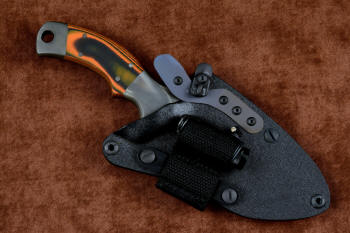 "Krag"  tactical, counterterrorism, crossover knife, LIMA mounted view in T4 cryogenically treated 440C high chromium martensitic stainless steel blade, 304 stainless steel bolsters, Orange and Black  G10 fiberglass/epoxy composite handle, hybrid tension tab-locking sheath in kydex, anodized aluminum, black oxide stainless steel and anodized titanium