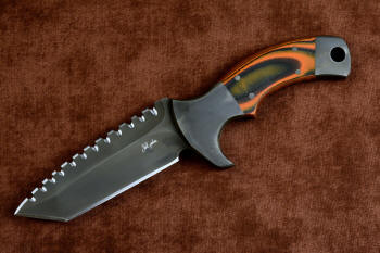 "Krag" tactical, counterterrorism, crossover knife, obverse side view in T4 cryogenically treated 440C high chromium martensitic stainless steel blade, 304 stainless steel bolsters, Orange and Black  G10 fiberglass/epoxy composite handle