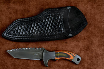 "Krag" tactical, counterterrorism, crossover knife, obverse side view in T4 cryogenically treated 440C high chromium martensitic stainless steel blade, 304 stainless steel bolsters, Orange and Black  G10 fiberglass/epoxy composite handle, heavy 9-10 oz. thick leather sheath with nylon stitching and black oxide stainless steel fasteners