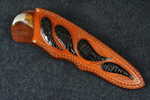 "Lanceolate" knife sheathed view in T3 deep cryogenically treated 440C high chromium martensitic stainless steel blade, 304 stainless steel bolsters, Cady Mountain Plume Agate gemstone handle, hand-carved leather sheath inlaid with black caiman skin