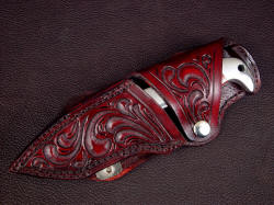 "Last Chance LT" sheathed view. Sheath is tough and durable, nicely hand-carved, dyed, lacquered, and sealed. Knife is retained with welt stack at rear bolster and snap flap
