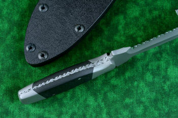 "Lynx" Custom tactical knife, tang view showing filework and tapered tang  in T3 cryogenically treated ATS-34 high molybdenum martensitic stainless steel blade, 304 stainless steel bolsters, carbon fiber handle, hybrid tension tab-wedge sheath in kydex, anodized aluminum, anodized titanium, blackened stainless steel