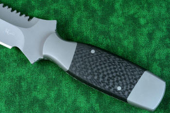 "Lynx" Custom tactical knife, carbon fiber handle detail in T3 cryogenically treated ATS-34 high molybdenum martensitic stainless steel blade, 304 stainless steel bolsters, carbon fiber handle, hybrid tension tab-wedge sheath in kydex, anodized aluminum, anodized titanium, blackened stainless steel