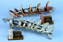 "Mesabi" and "Toroweap" custom knife sculpture in 440C high chromium martensitic stainless steel blades, hand-engraved 304 stainless steel bolsters, Picasso Marble gemstone and Fossil Stromatolite gemstone handles, stands in cast bronze and ziricote hardwood, brass