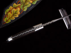 "Morta" knife filework edgework detail. Deep relief pattern in damascus carbon steel blade