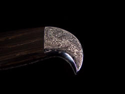 "Morta" obverse side rear bolster detail. High resolution engraving by hand in high nickel, high chromium stainless steel. 