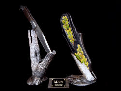 "Morta" knife sculpture, left rear view. Knife and stand rest in complimentary hand-cast bronze stands