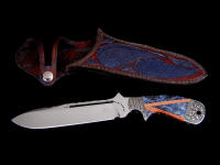 "Mountain Creature" obverse side view in milled 440C high chromium stainless steel blade, hand-engraved carbon steel bolsters, mosaic gemstone handle of blue sodalite and Italian goldstone, hand-carved leather sheath inlaid with blue rayskin