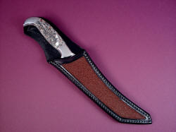 "Nereid" sheathed view. Sheath protects the blade edge and point, displaying the gemstone handle