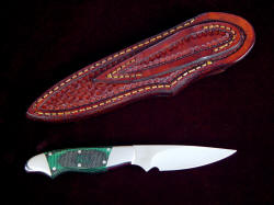 "Nihal" reverse side view. Knife has clean and light lines, accurate fit, with a small basketweave sheath to match