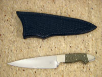 "Nihal Magnum," obverse side view in ATS-34 high molybdenum stainless steel blade, nickel silver bolsters, green canvas Micarta phenolic handle, black basketweaved leather sheath