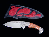 "Ocate" fine handmade custom skinning, field dressing knife, obverse side view in engraved 440C high chromium stainless steel blade, 304 stainless steel bolsters, copper ore gemstone handle, red Stingray skin inlaid in hand-carved leather sheath
