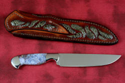 "Opere" reverse side view in 440C high chromium martensitic stainless steel blade, 304 stainless steel bolsters, Bay of Fundy Fossilized Agate gemstone handle, frog skin inlaid in hand-carved leather sheath