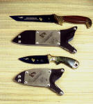 Older, early Pararescue knives, both with nitrate cobalt blued steel blades with nickel, gold electroplate in O1 high carbon tungsten-vanadium alloy tool steel, hand-engraved brass bolsters, banded Jasper/hematite, British Colombian Jade gemstone handles, locking kydex, aluminum, stainless steel sheaths with etched nickel silver flashplates