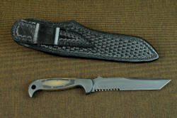 "PJLT" reverse side view with sheath back. Sheath has high belt loop, accommodating a 1.5" belt width