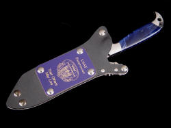 USAF Pararescue commemorative knife, sheathed view. Sheath is postivelyl locking, with removeable, reversible belt loops and all stainless components