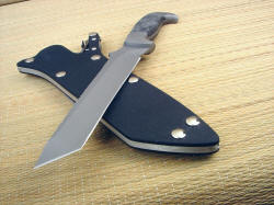 "PJ" tactical defensive knife, blade point view. The tanto blade is thin, yet very strong due to the wide angle of the point.