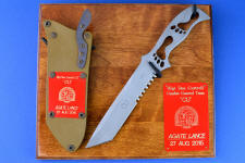 "PJSK" Custom Commemorative/Tactical Combat knife, obverse side, plaque view in 440c high chromium stainless steel blade, hybrid tension-locking sheath in kydex, anodized aluminum, titanium, stainless steel with plaque of ash and engraved laquered brass