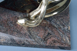 "Pallene" custom handmade knife sculpture, base detail. Bronze is secured by stainless steel machine screws through granite base