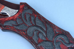 "Pallene" custom handmade knife sculpture, sheath front detail. Many pieces of individually inlaid black rayskin in hand-carved leather shoulder