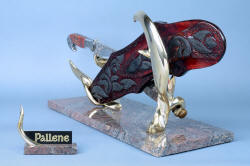 "Pallene" custom handmade knife sculpture, back side left view. Heavy bronze sculpture elevates knife and sheath, balances mass of sculpture