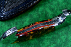 "Quetzal" inside handle tang enlargement and detail view, in deep cryogencially treated, hot blued O1 high carbon tungsten-vanadium tool steel blade, 304 stainless steel bolsters, Pilbara Picasso Jasper and Red River Jasper gemstone handle, hand-carved leather sheath inlaid with shark skin