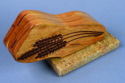 "Sasserides and Courgette" fine handmade  bread knife set, block for bread knives is made of cherry hardwood, mounted to a base of Kashmir granite with garnets, finished and polished throughout