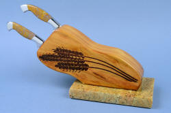 "Sasserides and Courgette" fine handmade  bread knife set, right side view of block. Wheat stalks are laser engraved deeply into the cherry hardwood block