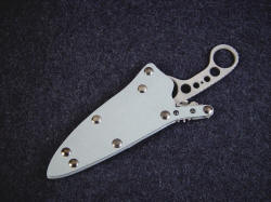 "Shank" sheathed view. Sheath is positively locking and secure, double thick and strong with aluminum and stainless steel.