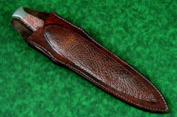 "Streamspear" dagger, sheathed view. Sheath is deep with high back and heavy leather shoulder inlaid with Bison skin