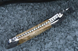 "Talitha" inside handle tang detail. Bolsters are dovetailed and bed fossil gemstone handle scales
