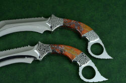 "Titan" karambits, fine handmade custom knives, obverse side views. Knives are matched yet distinctive and individual