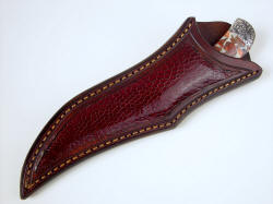 "Trifid" sheathed view. Sheath is deep and protective, tough ostrich leg skin compliments leather and knife. Surfaces are clean, smooth and glossy.